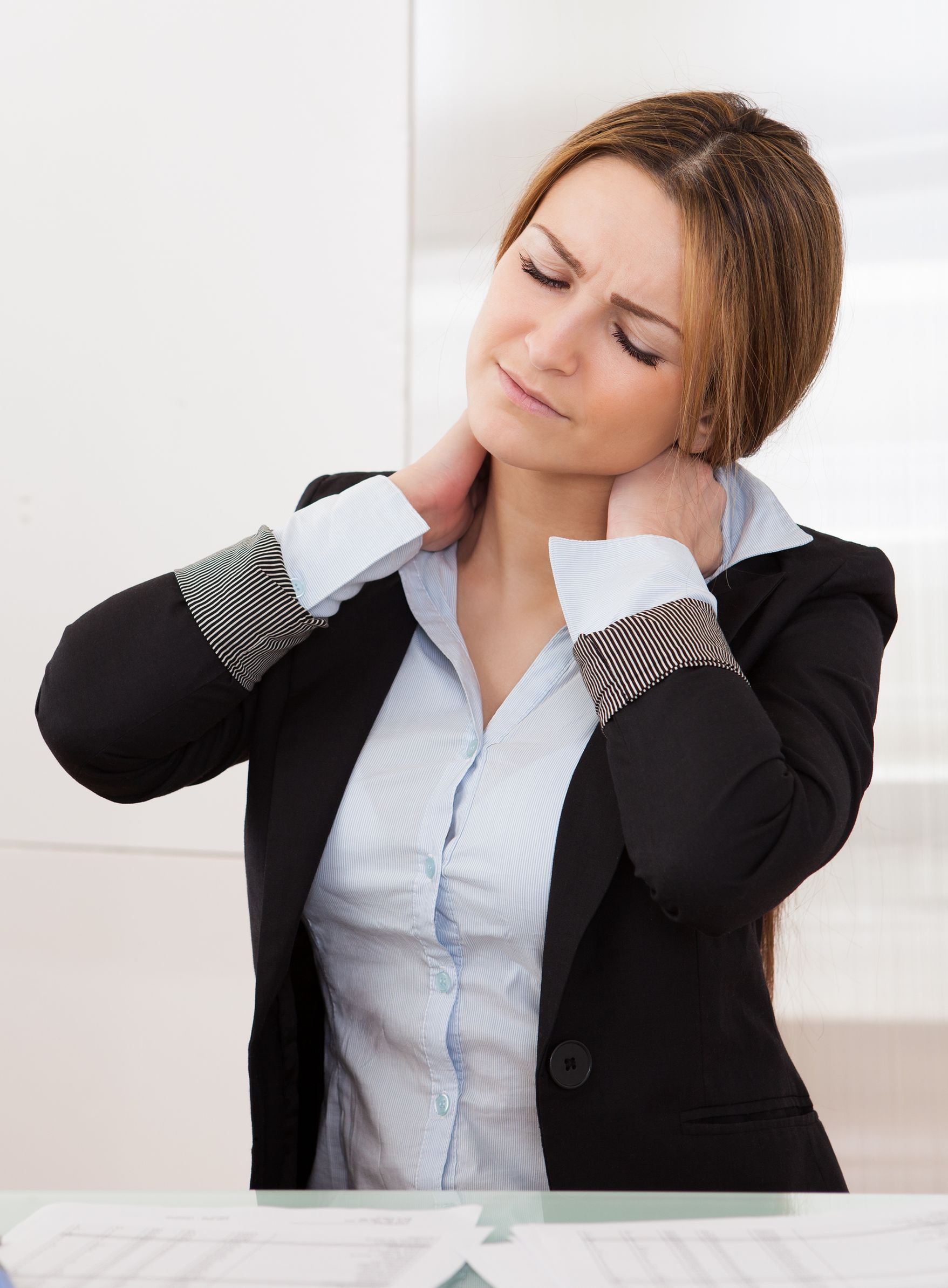 19168037 - young attractive businesswoman suffer from neck pain